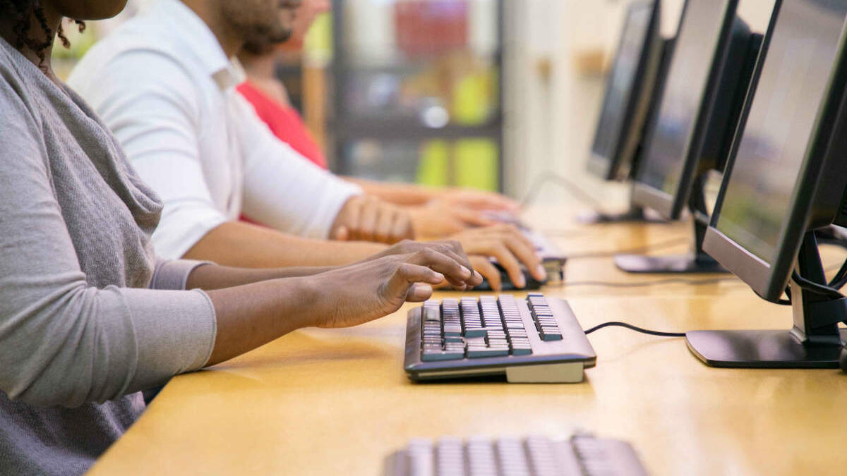 women typing on a keyboard