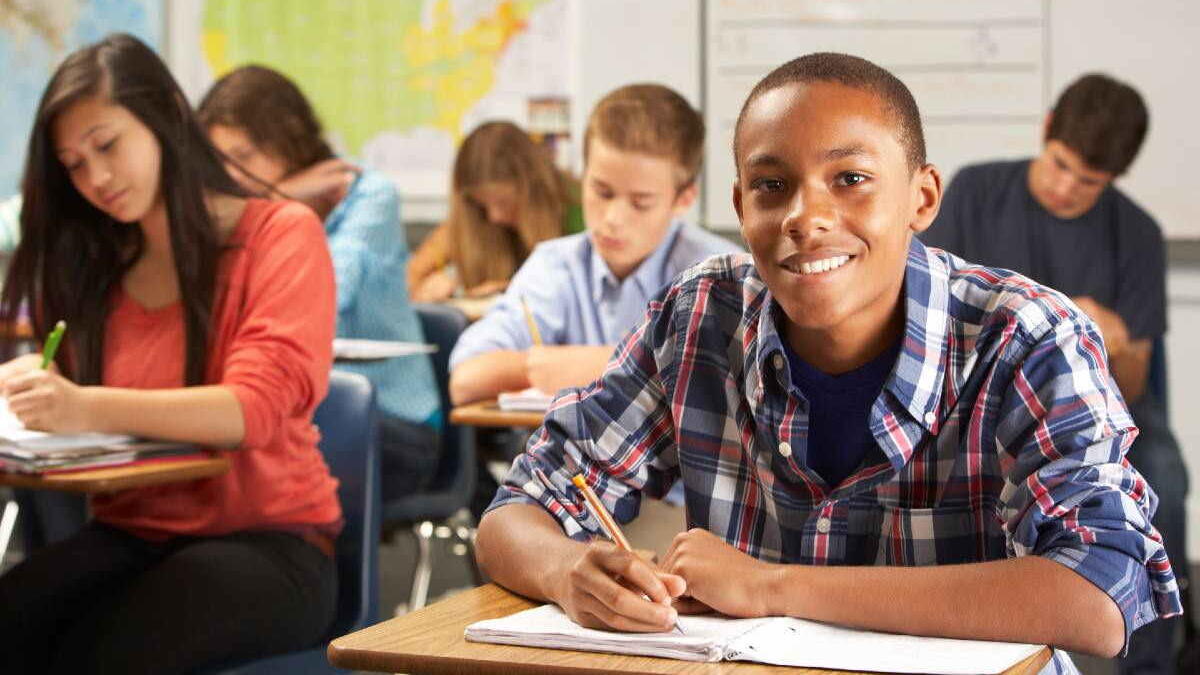 Group of student writing in a classroom