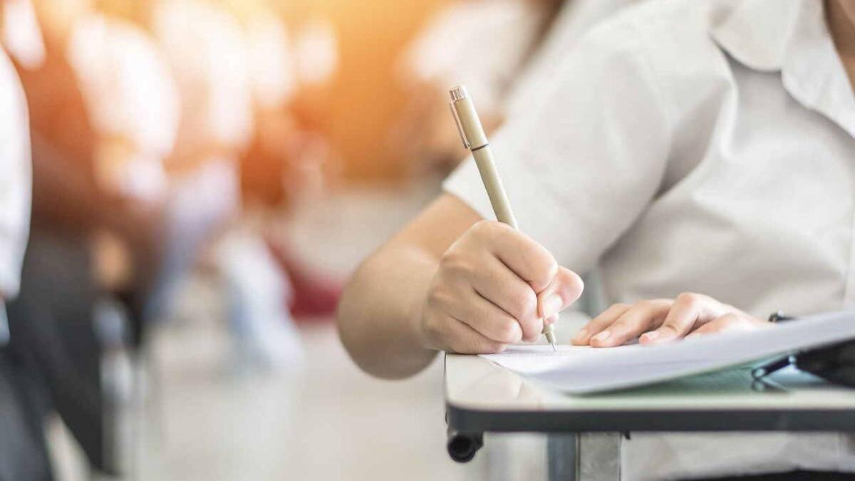 Student taking a paper based exam