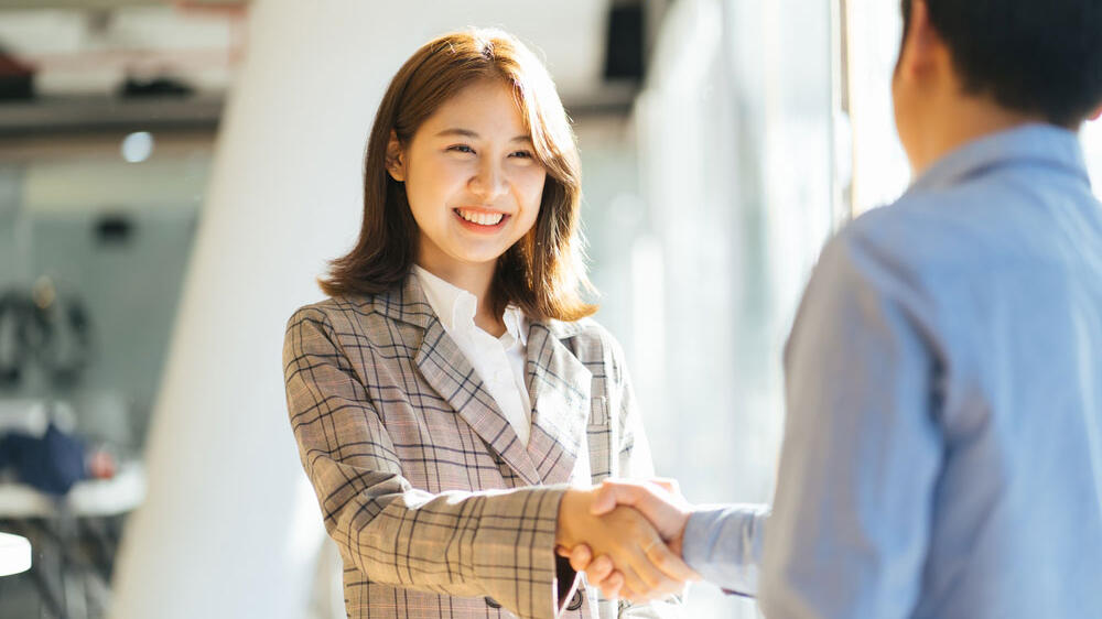 shaking hands on new online assessment system