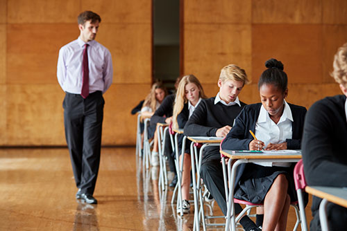 invigilator observing exam